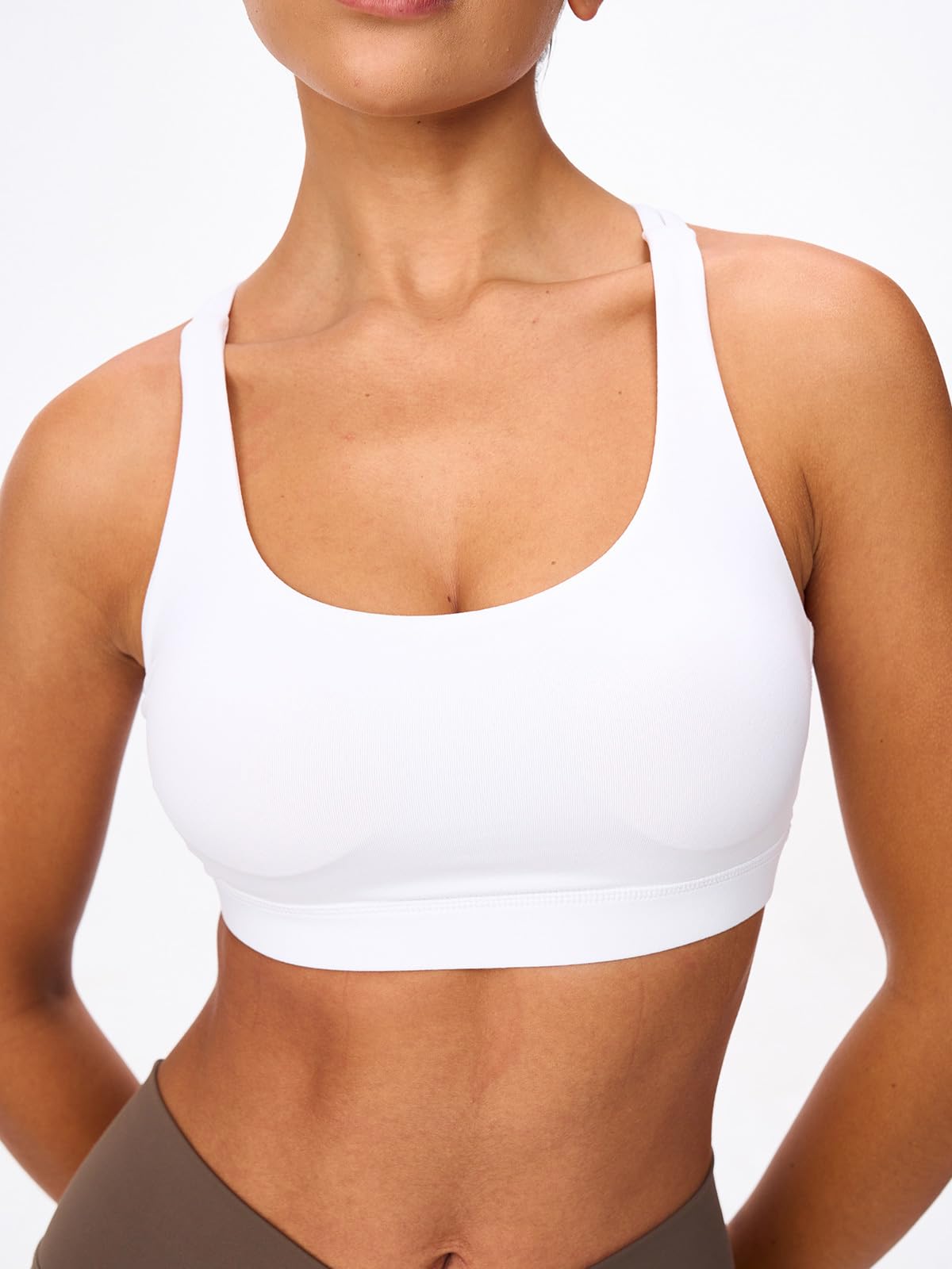 Front view of the Omwilddo sports bra showing the supportive U-neckline and smooth fabric.
