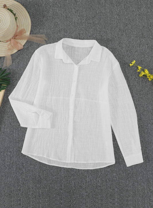 Flat lay of the Astylish white linen shirt showing the collared neckline and clean button-down front.