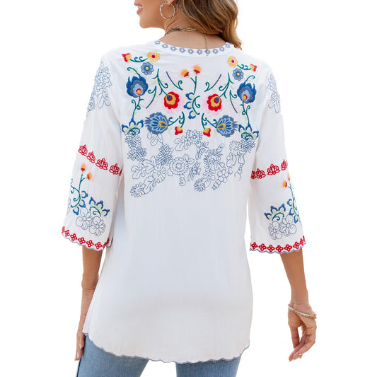 Back view of GORGLITTER floral embroidered top showing intricate boho patterns on the upper back and sleeves.