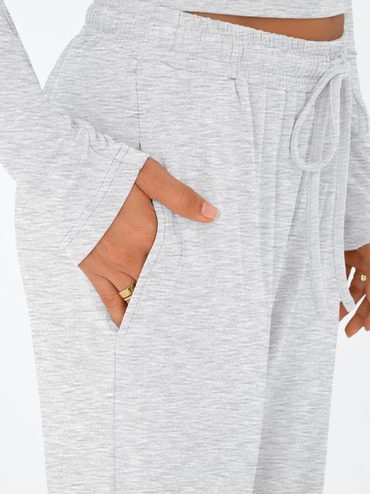 Close-up of the functional side pocket and adjustable drawstring waist on the wide-leg lounge pants.