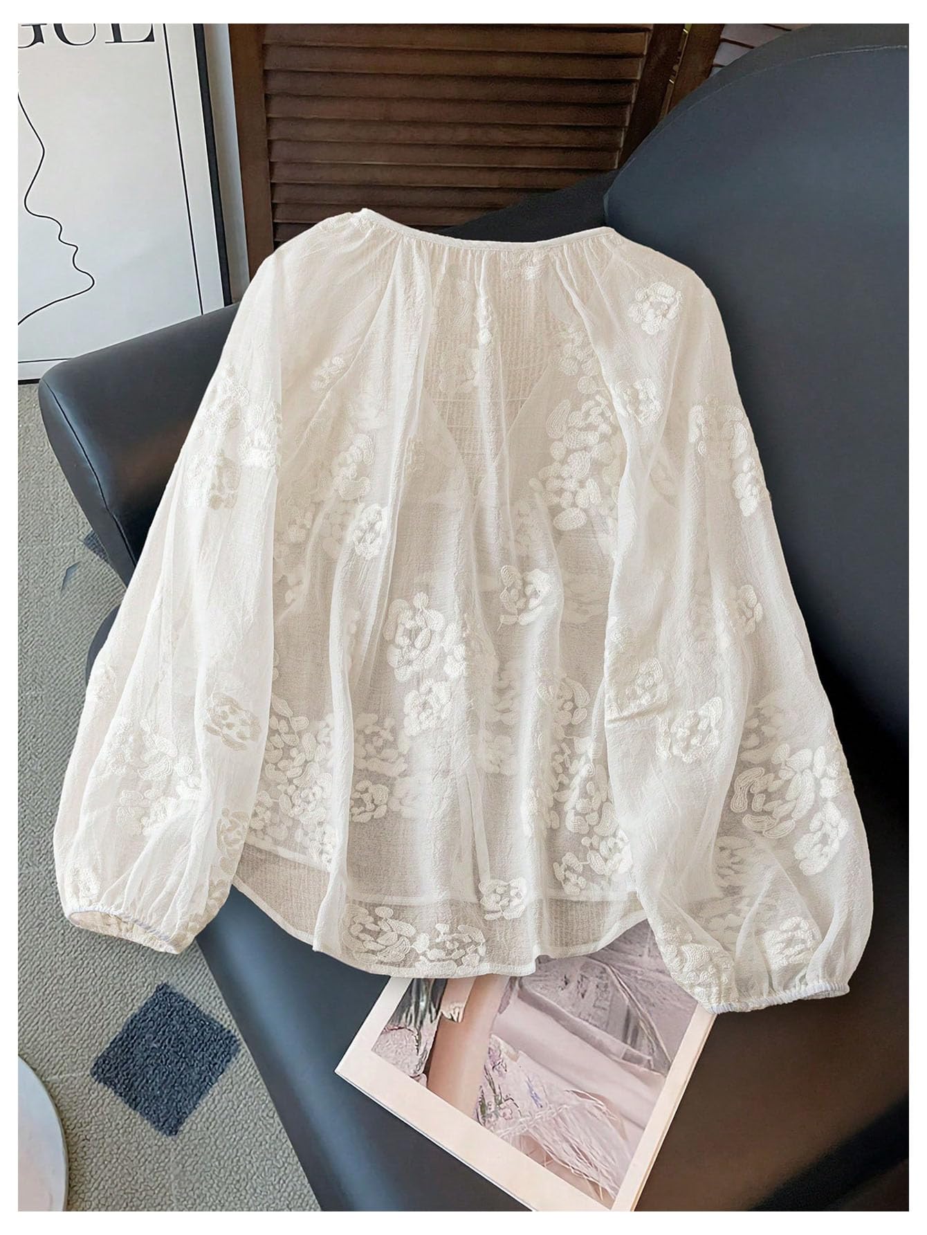 Back view of a white blouse with puff sleeves