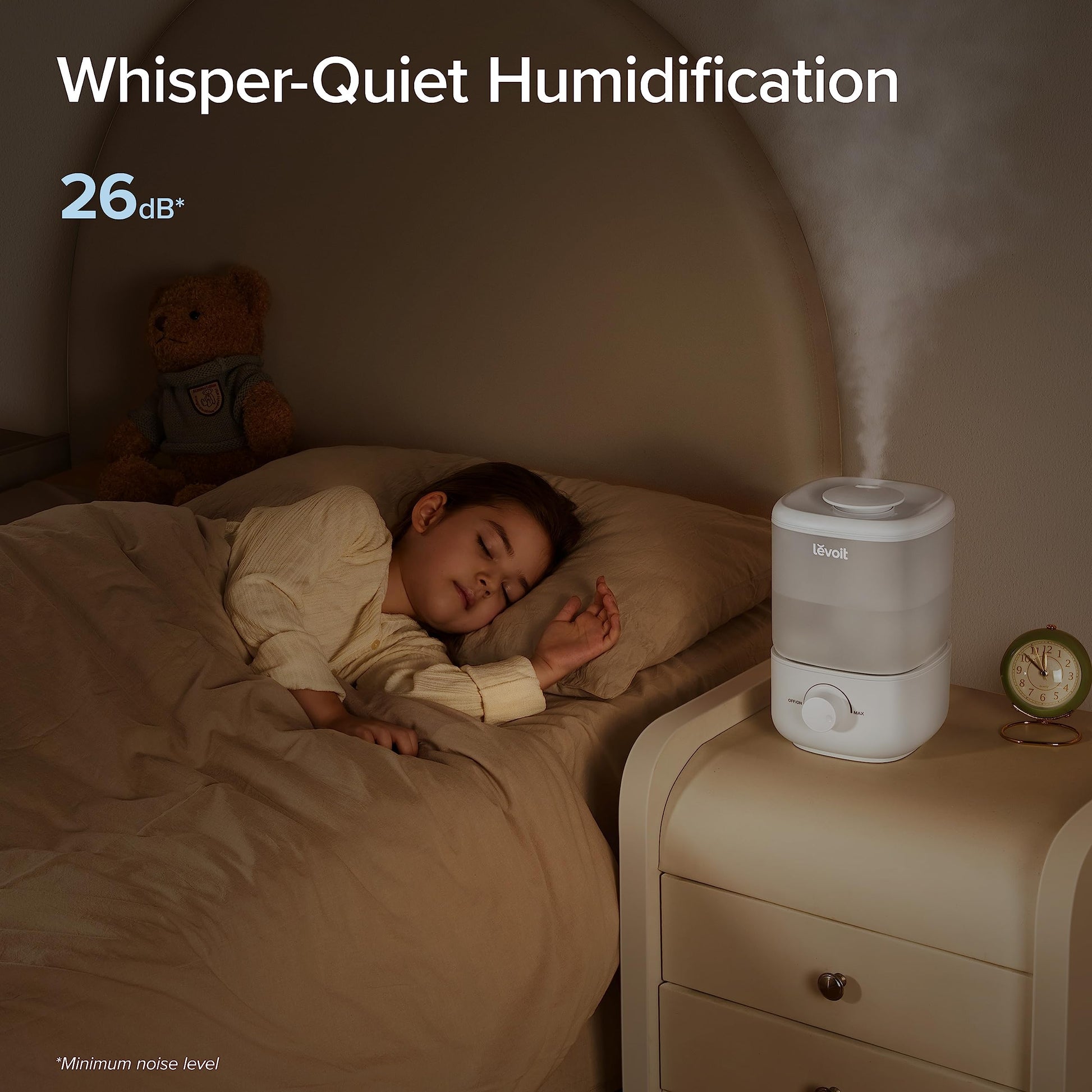 A child sleeping peacefully next to a LEVOIT humidifier, highlighting the 26dB whisper-quiet operation