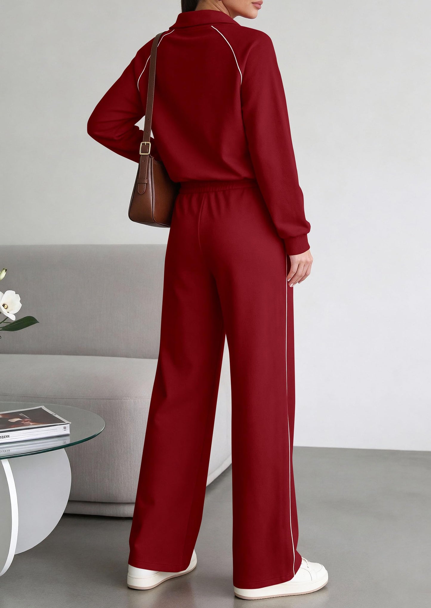Detailed view of the adjustable drawstring waistband and side pockets on the burgundy wide-leg palazzo pants.