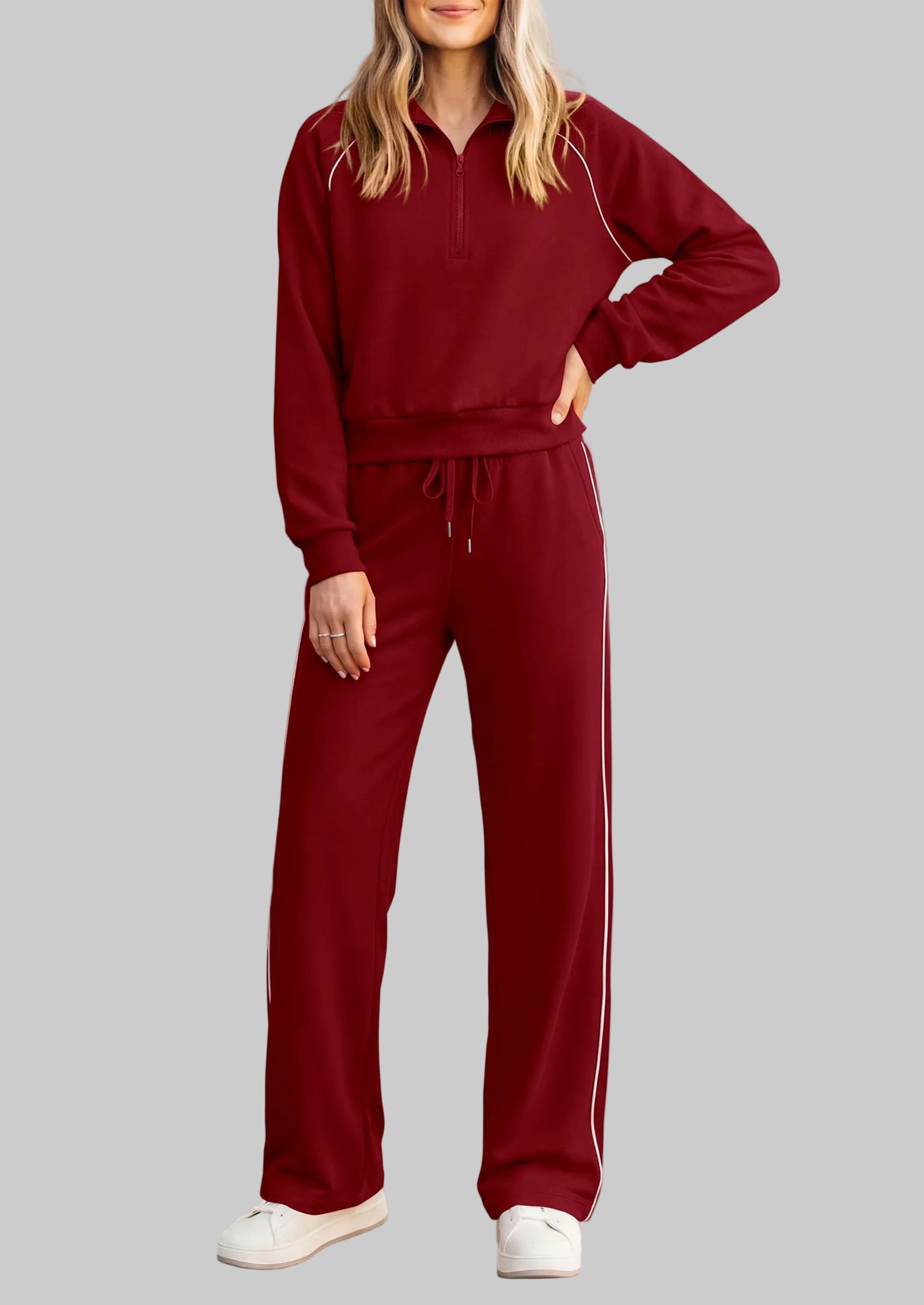 Full front view of a woman wearing the PRETTYGARDEN burgundy 2-piece tracksuit set, featuring a half-zip pullover and wide-leg pants.