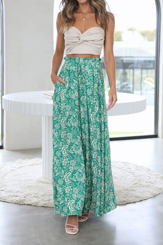 Front view of the green printed YOCUR trousers highlighting the high elastic waist.